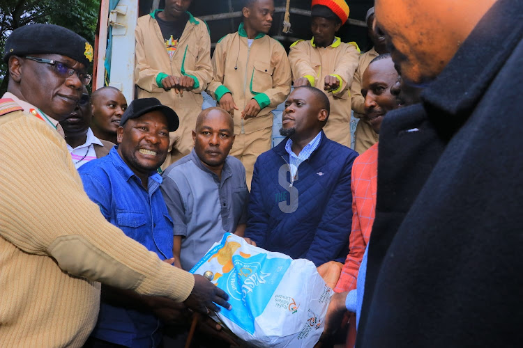 Nairobi Governor Johnson Sakaja distributes relief food to victims of floods in Kibera on April 29, 2024.
