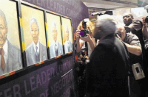 PAYING HOMAGE: Archbishop Desmond Tutu, a favourite of the media, visits the exhibition. 08/11/08. © Unknown.