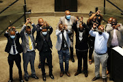 Members of the minority opposition bloc in the city of Johannesburg dramatically tied their arms with chains, accusing council speaker Vasco da Gama of attempting to gag them.