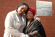 Nomava Dire, the daughter of the late  Senkubele Dire, with her aunt Gabantathe Dire, outside the Benoni Magistrate's Court yesterday where they were attending a case of two suspects found with the late doctor's car. 
