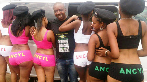 ANC Youth League deputy president Desmond Moela with women showing off their branded underwear