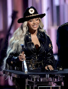 Beyoncé wears a cowboy-inspired Versace ensemble at the 2024 iHeartRadio Music Awards.