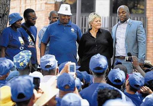 NO HURRY: Former NPA head of commercial crimes unit Glynis Breytenbach looked relaxed in a black top and matching pants on Monday as she and her lawyer Gerhard Wagenaar (LEFT WITH A BROWN JACKET) were on her way was escorted from the Pretoria Central police station cells to the nearby Pretoria Magistrate’s Court. The two appeared in court on charges of obstruction, defeating the ends of justice of justice and contravention of NPA Act after handing themselves for arrest. The duo was not asked to plead and the matter was postponed to March 16 for the appointment of the presiding magistrate and were released on R10 000 bail each