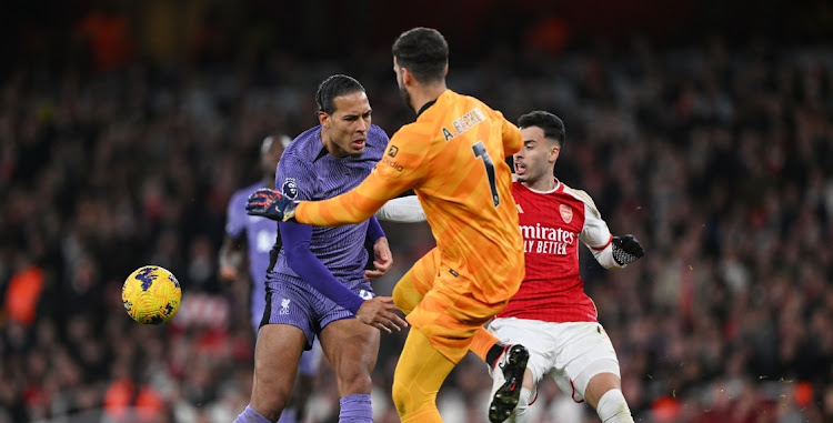 A defensive error from defender Virgil van Dijk and goalkeeper Alisson Becker of Liverpool leads to Gabriel Martinelli taking a shot and scoring Arsenal’s second goal in their Premier League match at Emirates Stadium in London on Sunday. Picture: GETTY IMAGES/SHAUN BOTTERILL