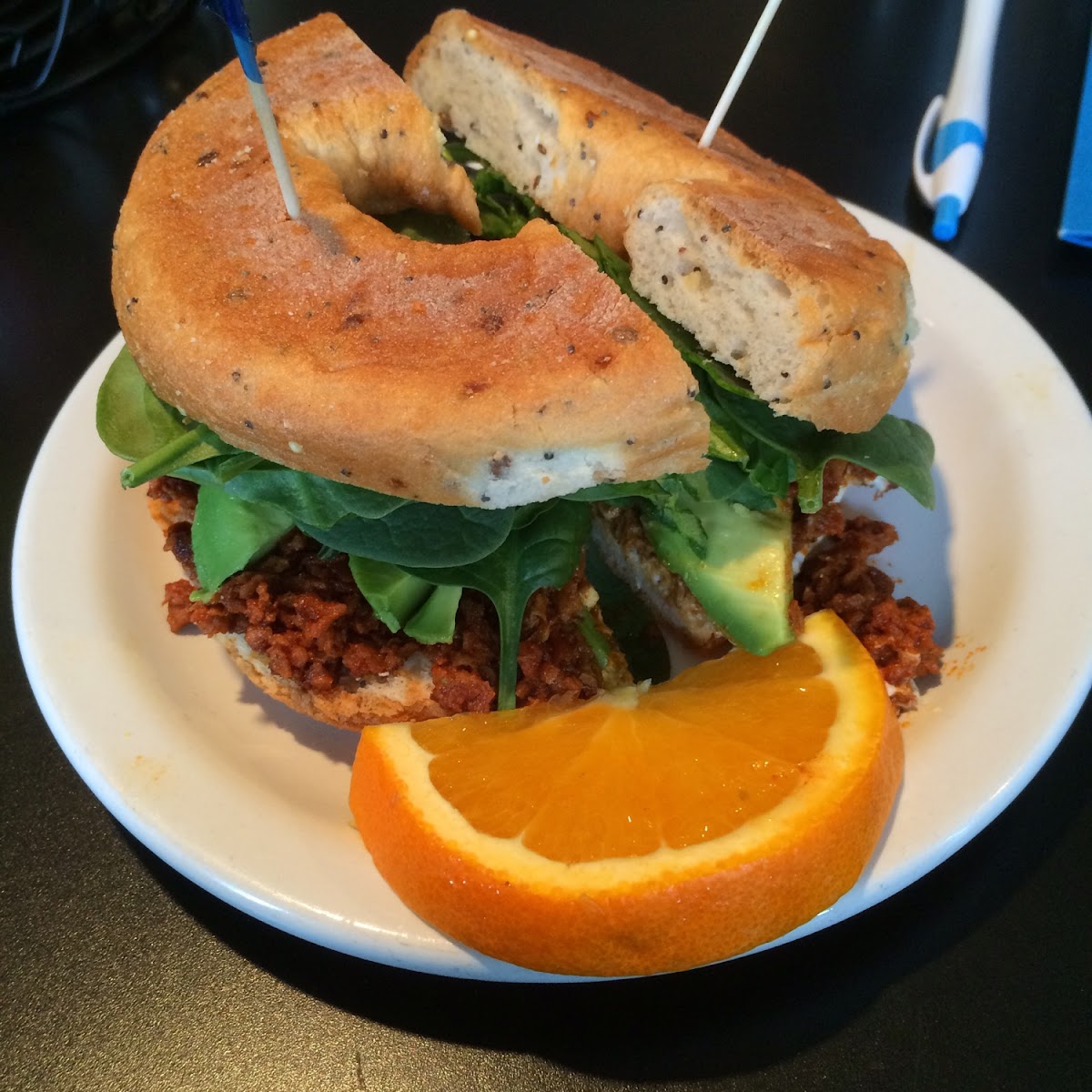 GF Bagel, goat cheese, spinach & avocado sandwich.