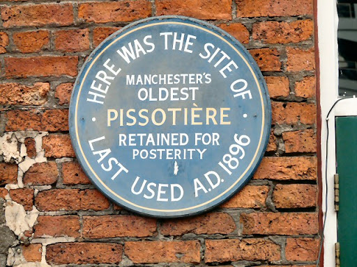 On the side of the Lass o' Gowrie SJ8497 : Lass o' Gowrie a plaque states Here was the site of Manchester's Oldest Pissotiere Retained for Posterity Last used A.D.1896 © Copyright Gerald England...