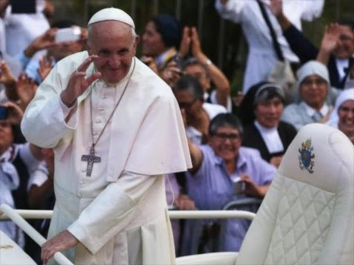 Pope Francis was greeted by thousands of people on the streets of Lima. AGENCIES