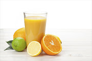 Orange juice and citrus fruits - Stock image