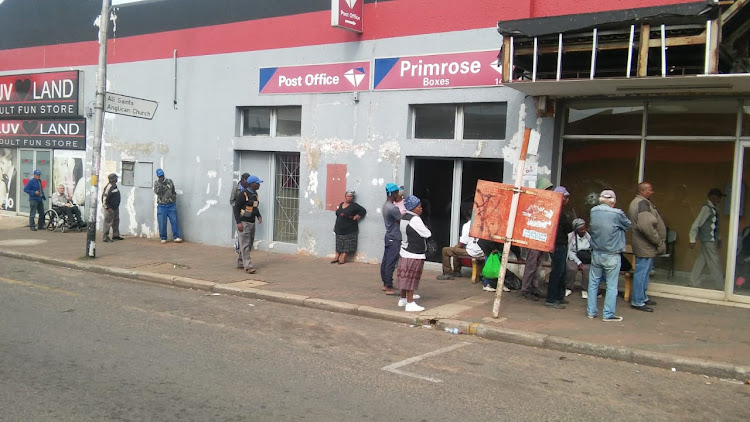 Pensioners queue outside the Primrose Post Office. They thanked government for separating their payment dates from that of the child grant as this reduced the queues.