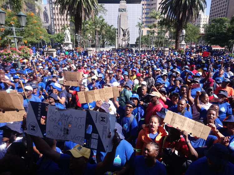 Thousands of striking waste and sanitation workers gathered outside the Durban City Hall on Thursday.