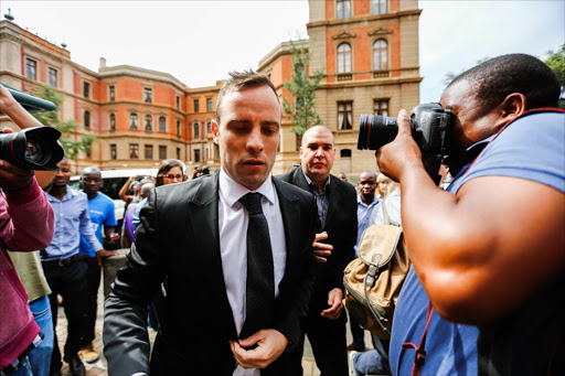 08 December 2015. South African Olympian Oscar Pistorius arrives at the North Gauteng High Court in Pretoria for his bail application. Moments later he was granted bail while he awaits sentence for murdering his girlfriend Reeva Steenkamp in 2013. Bail was set at 10,000 rand, Pistorius was deemed not to be a flight risk by Judge Audrey Ledwaba. Pistorius can remain under house arrest at his uncle's home until sentencing next year April the 18th and will be electronically tagged. He also had to hand over his passport.