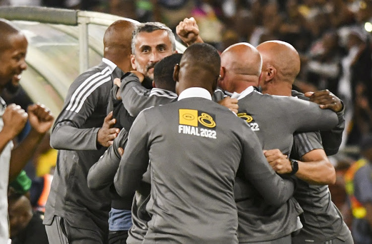 Orlando Pirates coach Jose Riveiro celebrates winning the MTN8 final against AmaZulu with his technical staff at Moses Mabhida Stadium in Durban on November 5 2022.