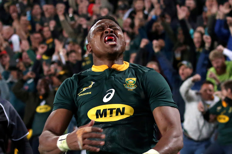 South Africa’s Aphiwe Dyantyi celebrates scoring a try against England at Ellis Park in Johannesburg, on June 9, 2018.