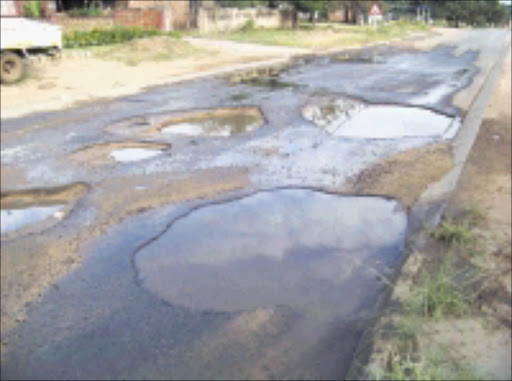 POTHOLES EVERYWHERE: These potholes have even turned away delivery trucks, resulting in business people travelling longer distances to buy bread for thier shops. 05/04/2009. Pic. Riot Hlatswayo. © Sowetan. IN DEEP TROUBLE: An investigation into potholes in Johannesburg and Durban, conducted by the Democratic Alliance, found that 'years of neglect and poor planning have generated a problem that is as widespread as it is acute'. Business Day. 11/02/2010. Pg 04.