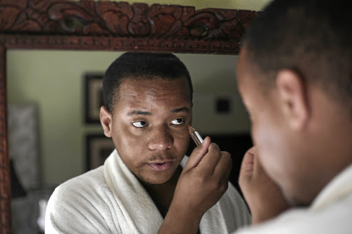 Kennedy Thabiso Molekwa does his makeup. Picture: Alaister Russell