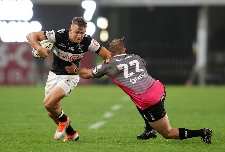 Jeremy Ward of the Sharks evades a tackle from Jerome Pretorius of the Pumas during the Currie Cup match at the GrowthPoint Kings Park in Durban on September 7, 2018.