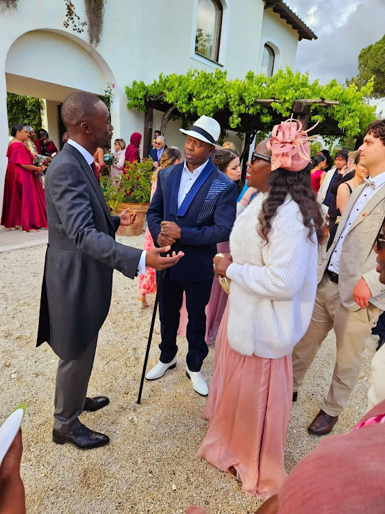Kigen Moi chats with family members during his white wedding in Rome, Italy.