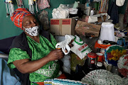 Nosizwe Dingaan cuts single-use plastic bags into strips to crochet hats and door stoppers.