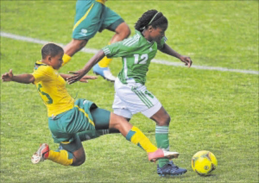 GETAWAY GIRL: Marjory Nyaumwe of Zimbabwe slips a tackle from Jane Refiloe of Banyana during the women's friendly match in Daveyton yesterday. Photo: Gallo Images