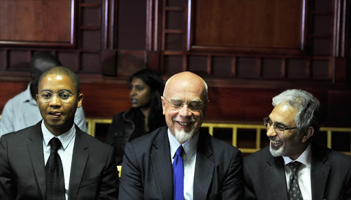 Yolisa Pikie, Peter Richer and Ivan Pillay appear at the Labour court on December 17, 2014 in Johannesburg, South Africa.