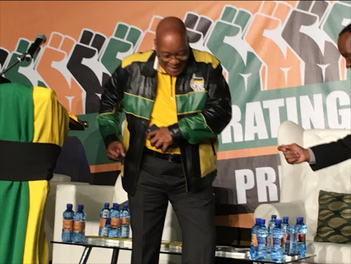 President Jacob Zuma arrives with a dance at his 75th birthday celebration in Kliptown.