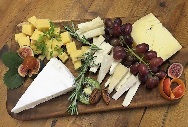 A delectable selection of cheeses on a cheeseboard.
