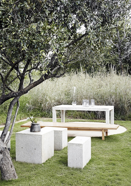 A flat, grassy rectangle mirrors the interior space of the home's top entertainment area.