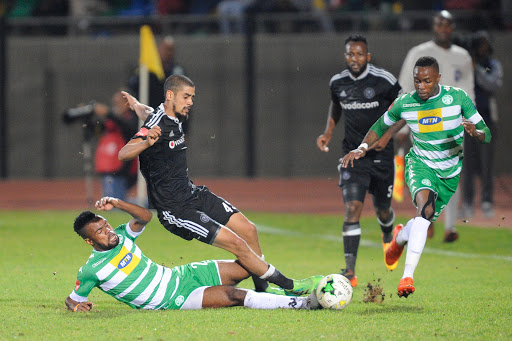Didier Lebri (L) of Bloemfontein Celtic and Abbubaker Mobara (R) of Orlando Pirates during the Absa Premiership match at Dr. Molemela Stadium on May 10, 2017 in Bloemfontein, South Africa.