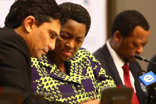 Former Minister of Social Development DG Zane Dangor (left) and the Minister of Social Development Bathabile Dlamini (right) chat ahead of a press conference at Parliament. Picture Credit: Halden Krog. © The Times