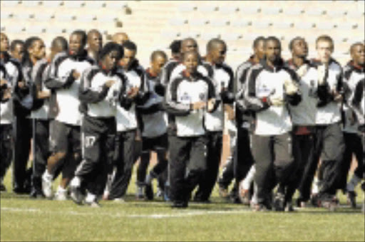 IN RHYTHM: Orlando Pirates players during a training session at Johannesburg Stadium yesterday. Pic. Mohau Mofokeng. 16/07/08. © Sowetan.