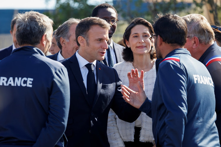 France's President Emmanuel Macron and France's sports minister Amelie Oudea-Castera meet with officials at the Marina Olympique nautical base in Marseille, France, May 8 2024. Picture: LUDOVIC MARIN/REUTERS