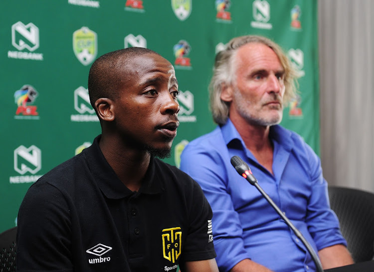Cape Town City midfielder Thabo Nodada (L) speaking at a media briefing in Cape Town alongside head coach Jan Olde Riekerink (R) on February 6 2020, arrived in the Mother City aged 21 and has grown to be counted among the senior players at the Citizens.