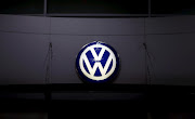 A logo of Volkswagen is illuminated at a dealership in Seoul, South Korea, in this November 25, 2015 file photo. REUTERS/Kim Hong-Ji/Files