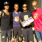 Kaizer Chiefs players (L-R) Morgan Gould, Siboniso Gaxa and Tsepo Masilela posing with well-known DJ Sbu (far right) and his controversial energy drink Mofaya in April.