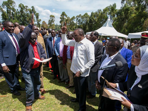 President Uhuru Kenyatta when he issued title deeds to residents of Chekyuk settlement scheme in Mt Elgon, Thursday, December 15. /PSCU