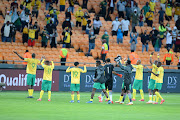Bafana Bafana players celebrate with supporters after the 1-0 win over Ethiopia in front of 2,000 vaccinated fans at FNB Stadium on October 12 2021. 