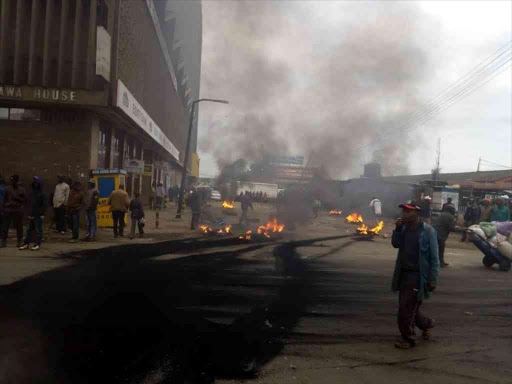 Chaos on Nairobi's Haile Selassie Avenue during a demonstration by Wakulima Market traders against high rates charged by the county, July 12, 2018. /COURTESY