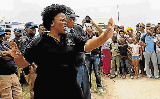 ON THE DEFENSIVE: A file picture of BCM councillor Zameka Gajula addressing angry residents in Unit P last year Picture: ALAN EASON