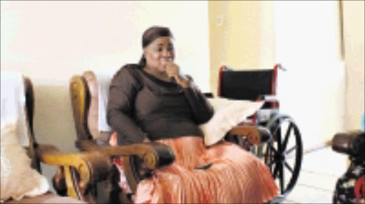WORRIED: Thembekile Ngubo says Ithala Bank has threatened to kick her out of her house because she cannot afford to pay the R945 a month bond instalments. Both her legs were amputated after she was diagnosed with diabetes. Pic: Mhlaba Memela. 18/10/2009. Sowetan.