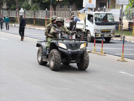 A file photo of police officers on patrol at Nairobi city. /FILE