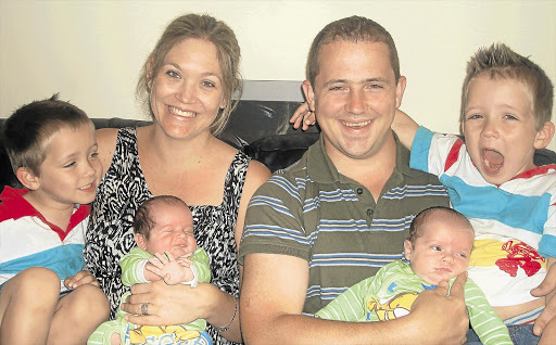 FOUR TIMES LUCKY: Mother Kim and dad Frederik Hefer and their sons, from left, Blake, Logan, Devon and Tristan Picture: SUPPLIED