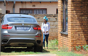 Kelly Khumalo arrives at her house in Spruitview on October 27, 2014 in Johannesburg, South Africa. Her boyfriend Senzo Meyiwa was shot and killed at Khumalo's house on Sunday evening.