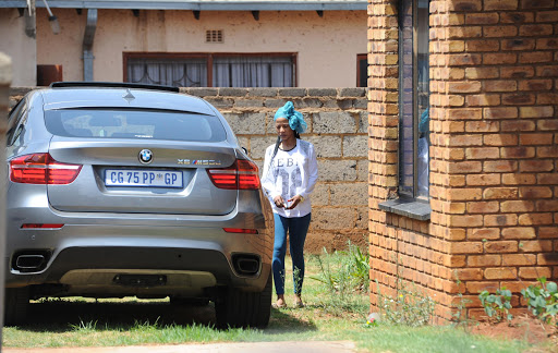 Kelly Khumalo arrives at her house in Spruitview on October 27, 2014 in Johannesburg, South Africa. Her boyfriend Senzo Meyiwa was shot and killed at Khumalo's house on Sunday evening.