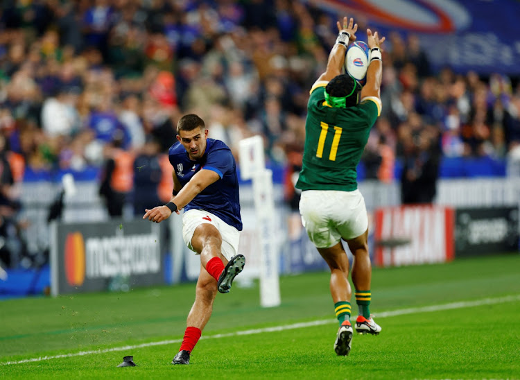 Cheslin Kolbe charges down the conversion kick by Thomas Ramos on Sunday night. Picture: GONZALO FUENTES/REUTERS