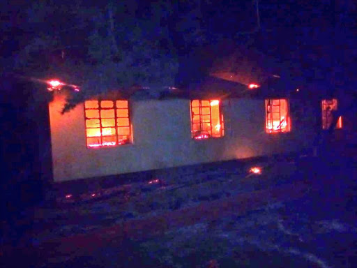 A dormitory on fire in one of the schools. /COURTESY