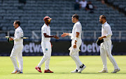 West Indies captain Kraigg Brathwaite shakes hands with South Africa's Gerald Coetzee after the end of the second Test on day four at the Wanderers in Johannesburg on March 11 2023.