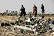Ethiopian police officers among the debris of the Ethiopian Airlines Boeing 737 Max 8 aircraft that crashed soon after take-off in March 2019. 