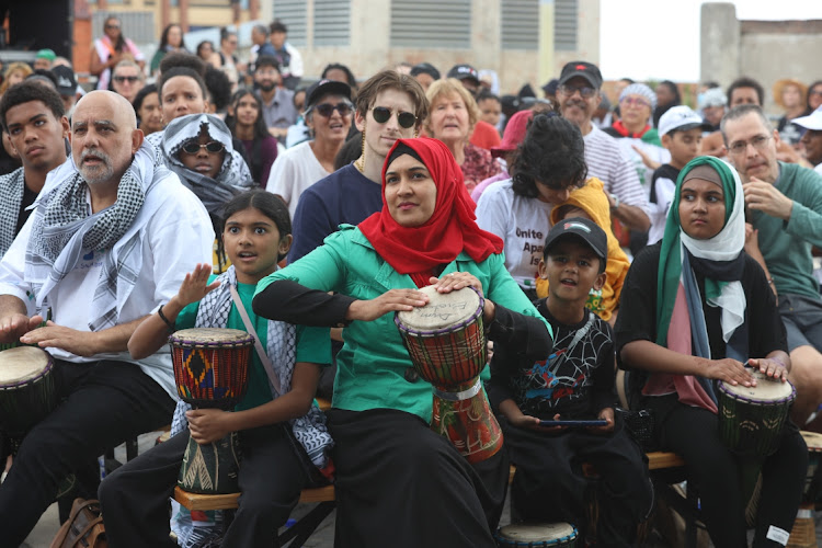 Activists beat drums to demonstrate they feel the plight of Palestinians.