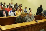 Piet Groenewald and his son Stephan Greef appearing at the Groblersdal magistrate’s court in Limpopo on Monday, where they were denied bail. 