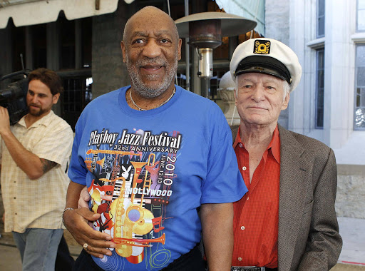 Playboy Magazine founder Hugh Hefner (R) and actor Bill Cosby arrive at a news conference at the Playboy Mansion in Los Angeles, California February 10, 2011. Hefner has submitted to questioning under oath in a lawsuit brought by a woman who has accused comedian Bill Cosby of sexually abusing her as a minor at the Playboy Mansion, her lawyer said on Friday. REUTERS/Fred Prouser/File Photo